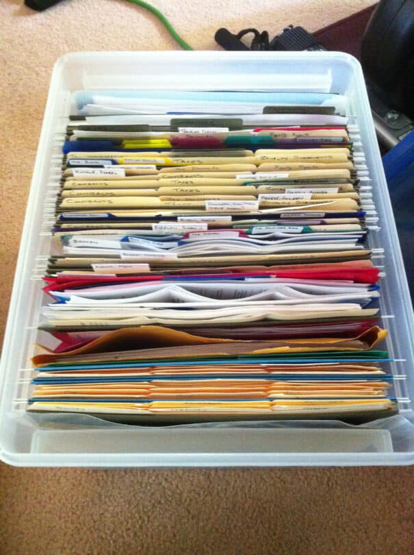 A file box with dozens of neatly labeled, colour-coded files